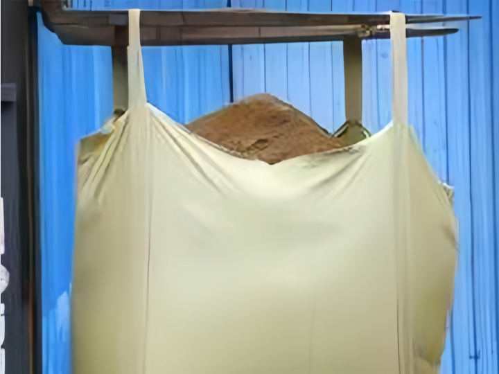 A yellow open bulk bag is a large, sturdy bag that is typically used for transporting and storing a variety of materials in bulk quantities.
